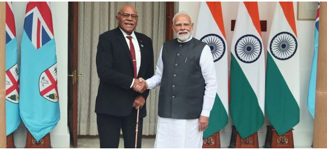 “India and Fiji leaders shaking hands, symbolizing strengthened bilateral relations”